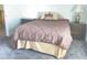 Comfortable bedroom featuring a queen-sized bed, two nightstands, and soft carpet at 3024 Pismo Beach Dr, Las Vegas, NV 89128