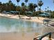 Sandy community beach with crystal clear water, perfect for relaxation and recreation at 3024 Pismo Beach Dr, Las Vegas, NV 89128