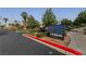 Desert Shores: A private community sign at the entrance amid landscaped greenery at 3024 Pismo Beach Dr, Las Vegas, NV 89128