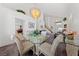 Bright dining area with modern chandelier, open layout, and seamless flow to the grand living room at 3024 Pismo Beach Dr, Las Vegas, NV 89128