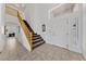 Grand foyer with staircase, high ceilings, decorative chandelier, and natural lighting at 3024 Pismo Beach Dr, Las Vegas, NV 89128