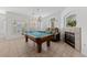 Bright game room featuring a billiards table, fireplace, and neutral color palette at 3024 Pismo Beach Dr, Las Vegas, NV 89128