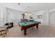 Cozy game room featuring a pool table, fireplace, and comfortable seating area at 3024 Pismo Beach Dr, Las Vegas, NV 89128