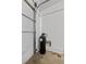 Garage corner features water conditioning equipment, next to the door for easy access and maintenance at 3024 Pismo Beach Dr, Las Vegas, NV 89128