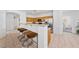 Bright kitchen with stainless steel appliances, breakfast bar, and tile flooring at 3024 Pismo Beach Dr, Las Vegas, NV 89128