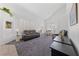 Spacious living room with vaulted ceilings, plantation shutters, and comfortable seating at 3024 Pismo Beach Dr, Las Vegas, NV 89128