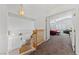 Hallway on upstairs landing features hardwood railing and offers access to bedrooms at 3024 Pismo Beach Dr, Las Vegas, NV 89128