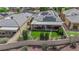 Backyard includes a covered patio and well-maintained lawn at 328 Wild Plum Ln, Las Vegas, NV 89107