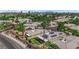 Aerial view of home featuring solar panels, covered patio, well-kept lawn and landscaping at 328 Wild Plum Ln, Las Vegas, NV 89107