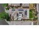 Aerial view of solar panels on home's roof, landscaped yard and mature trees at 328 Wild Plum Ln, Las Vegas, NV 89107
