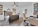 Bedroom featuring a ceiling fan, desk, chair, exterior view, and decor at 328 Wild Plum Ln, Las Vegas, NV 89107