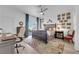 Bedroom with desk, chair, ceiling fan, and exterior view at 328 Wild Plum Ln, Las Vegas, NV 89107