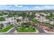 Aerial view of a gated community featuring manicured landscaping and mature trees at 328 Wild Plum Ln, Las Vegas, NV 89107