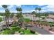 Welcoming community entrance featuring mature landscaping, trees, and well-maintained grounds at 328 Wild Plum Ln, Las Vegas, NV 89107
