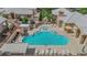 Inviting community pool with lounge chairs, tables and umbrellas for residents to enjoy at 328 Wild Plum Ln, Las Vegas, NV 89107