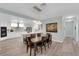 Dining area with modern light fixture, stainless steel appliances, and breakfast bar at 328 Wild Plum Ln, Las Vegas, NV 89107