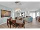 Open concept dining area with view of living room with a fireplace at 328 Wild Plum Ln, Las Vegas, NV 89107