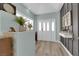 Welcoming entryway with modern decor and luxury vinyl plank flooring at 328 Wild Plum Ln, Las Vegas, NV 89107