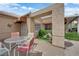 Private outdoor patio with seating, and desert landscaping at 328 Wild Plum Ln, Las Vegas, NV 89107