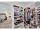 A well-organized closet with shelves and hanging racks offers plenty of storage at 328 Wild Plum Ln, Las Vegas, NV 89107