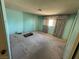 Bedroom with plush carpet, a window for natural light, and ample space at 4244 Gibraltar St, Las Vegas, NV 89121