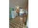 Functional kitchen features linoleum flooring, wooden cabinets, and a window overlooking the backyard at 4244 Gibraltar St, Las Vegas, NV 89121