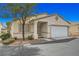 Charming single-story home with a two-car garage, mature tree, and neutral-toned stucco exterior at 5114 Mascaro Dr, Las Vegas, NV 89122