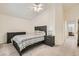 Spacious main bedroom with neutral carpet, ceiling fan, and ensuite bathroom access at 5114 Mascaro Dr, Las Vegas, NV 89122