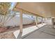 Covered patio with decorative fountain and hardscape features creates a relaxing outdoor space at 5114 Mascaro Dr, Las Vegas, NV 89122