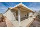Covered patio area includes columns, stucco walls, and access to outdoor storage at 5114 Mascaro Dr, Las Vegas, NV 89122