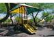 A fun ' playground featuring a colorful shade structure, slides, and climbing features for hours of safe play at 7633 Tender Tassels St, Las Vegas, NV 89149