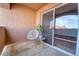 Cozy balcony with sliding glass doors, comfortable chair, and modern decor for relaxing outdoor living at 8101 W Flamingo Rd # 2059, Las Vegas, NV 89147