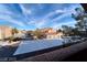 View of neighborhood with assigned parking, trees, and blue sky at 8101 W Flamingo Rd # 2059, Las Vegas, NV 89147