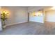 Open living room and kitchen area featuring modern flooring and neutral paint at 8101 W Flamingo Rd # 2059, Las Vegas, NV 89147
