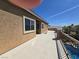 Balcony overlooking pool with outdoor seating and clear blue skies at 8303 Saddleback Ledge Ave, Las Vegas, NV 89147