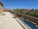 Balcony overlooking pool with outdoor seating and clear blue skies at 8303 Saddleback Ledge Ave, Las Vegas, NV 89147