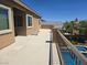 Balcony overlooking pool with outdoor seating and clear blue skies at 8303 Saddleback Ledge Ave, Las Vegas, NV 89147