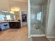 Elegant bathroom with glass shower and a large vanity with double sinks at 8303 Saddleback Ledge Ave, Las Vegas, NV 89147