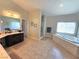 Bright bathroom features a soaking tub, a tile floor, and a double sink vanity at 8303 Saddleback Ledge Ave, Las Vegas, NV 89147
