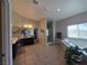 Large primary bathroom boasts vanity area, tiled floors, standing shower, tub, and a separate commode at 8303 Saddleback Ledge Ave, Las Vegas, NV 89147