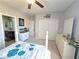 Primary bedroom boasts neutral walls, ceiling fan, ensuite bathroom, and a walk-in closet with sliding doors at 8303 Saddleback Ledge Ave, Las Vegas, NV 89147