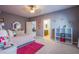 Comfortable bedroom featuring neutral carpet, soft pink accents, and plenty of natural light from windows at 8303 Saddleback Ledge Ave, Las Vegas, NV 89147
