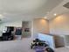 Large bonus room with carpet, television, and exercise equipment at 8303 Saddleback Ledge Ave, Las Vegas, NV 89147