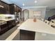 Spacious kitchen with center island, stainless steel appliances, and dark wood cabinetry at 8303 Saddleback Ledge Ave, Las Vegas, NV 89147