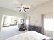 An ensuite living area offers comfortable space with a massage chair and view of the bed and dresser at 8303 Saddleback Ledge Ave, Las Vegas, NV 89147