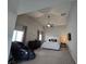 Main bedroom has vaulted ceiling, and includes a king bed, dresser and a large massage chair at 8303 Saddleback Ledge Ave, Las Vegas, NV 89147