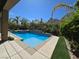 Backyard pool features a spa, desert landscaping, and plenty of sunshine for a refreshing experience at 8303 Saddleback Ledge Ave, Las Vegas, NV 89147