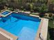 Beautiful pool with spa, cool blue water and grassy areas at 8303 Saddleback Ledge Ave, Las Vegas, NV 89147
