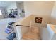 Staircase with carpet, that leads to an exercise room, features a railing and a painting on the wall at 8303 Saddleback Ledge Ave, Las Vegas, NV 89147