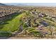 Expansive aerial view of a Primary-planned community with lush green park, walking trails, and basketball courts at 888 Cherry Glen Pl, Las Vegas, NV 89138